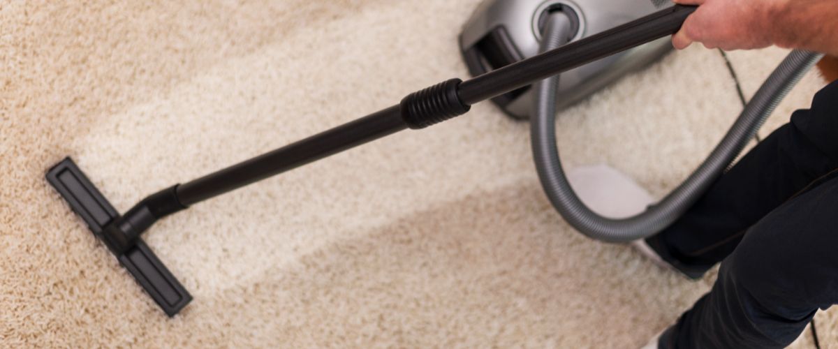 Close up vacuuming carpet (2)
